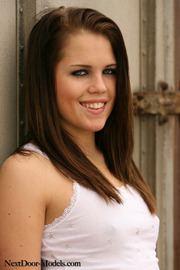 Brunette Girl Posing In Sexy Jeans Mini Skirt